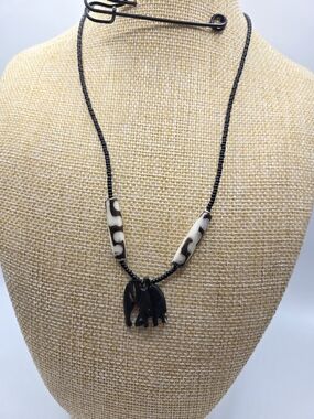 1593. Black Beaded Necklace with Bone  Beads and Elephant Pendant
